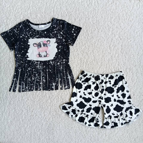 Black short sleeve with white spots and cow the short pants with cow line